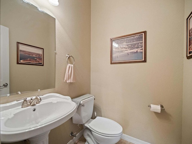 bathroom featuring sink and toilet