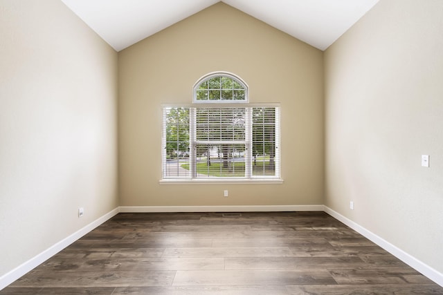 unfurnished room with dark hardwood / wood-style floors and lofted ceiling