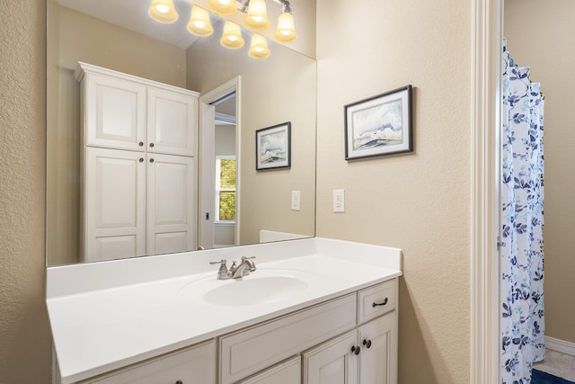 bathroom with vanity and curtained shower