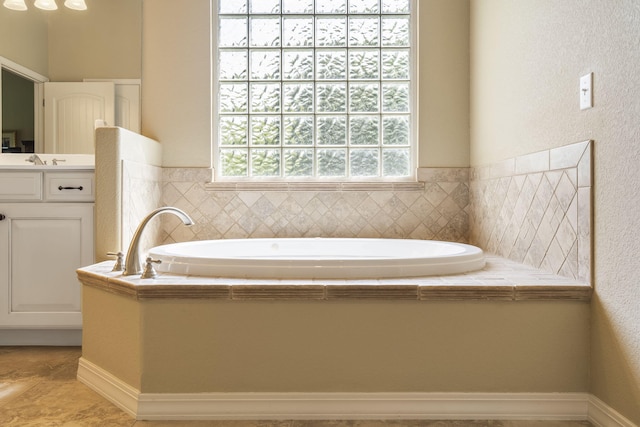 bathroom with a bathtub and vanity