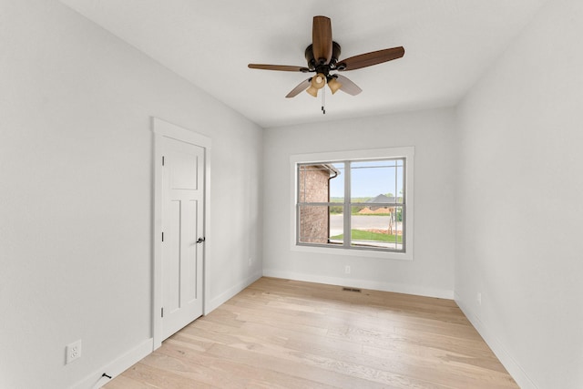 unfurnished room with ceiling fan and light hardwood / wood-style flooring