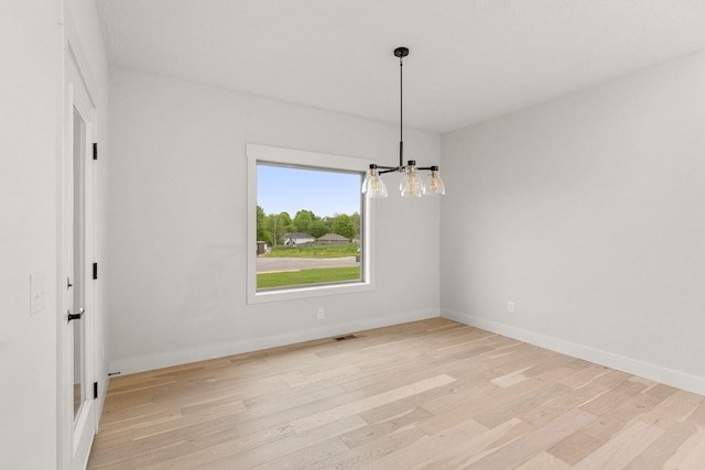 unfurnished room featuring light hardwood / wood-style flooring