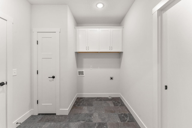 laundry area with hookup for a washing machine, cabinets, and electric dryer hookup