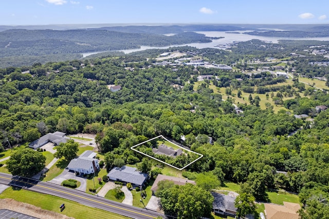 drone / aerial view featuring a forest view