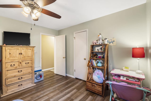 office with baseboards, ceiling fan, and dark wood finished floors