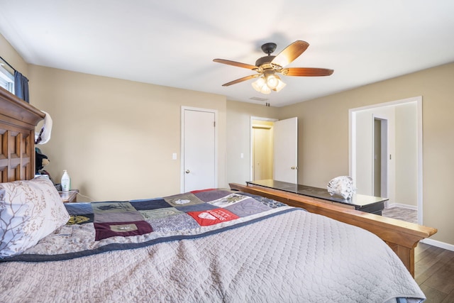 bedroom featuring ceiling fan and dark hardwood / wood-style floors