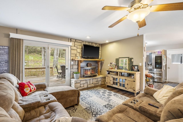 living room with wood-type flooring and ceiling fan