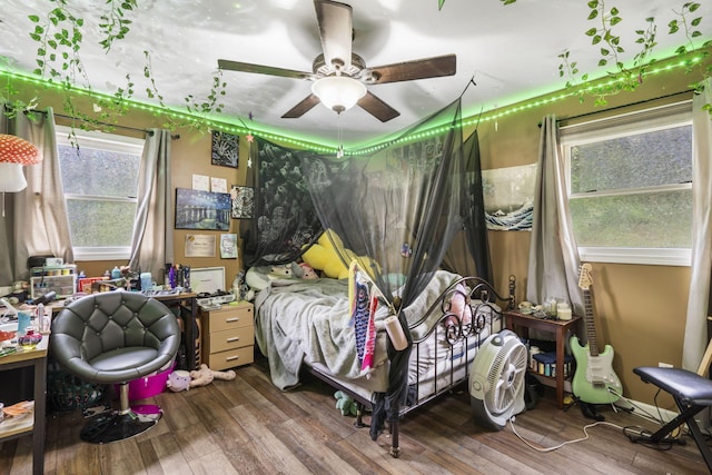 bedroom featuring hardwood / wood-style flooring and ceiling fan