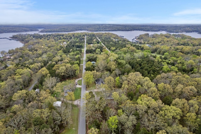 bird's eye view with a wooded view and a water view