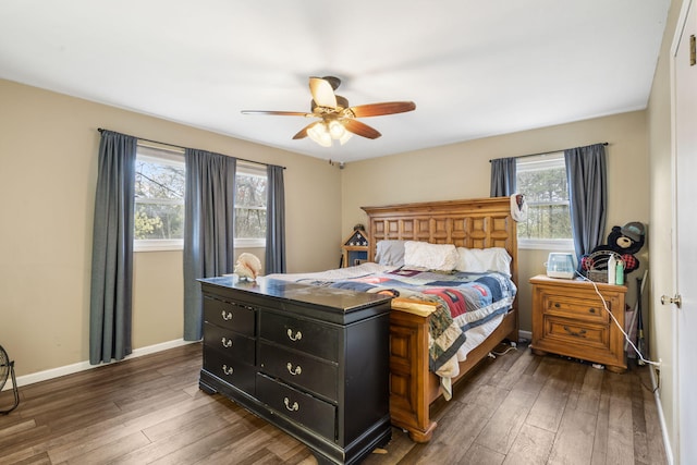 bedroom featuring baseboards, dark wood-type flooring, and ceiling fan
