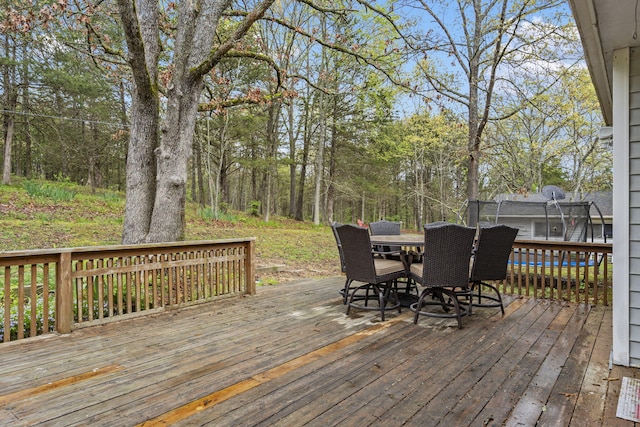 deck with outdoor dining area