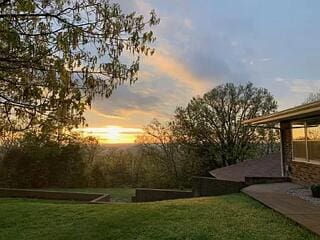 view of yard at dusk