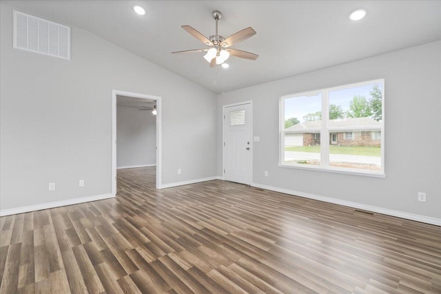 unfurnished living room with lofted ceiling, dark hardwood / wood-style flooring, and ceiling fan