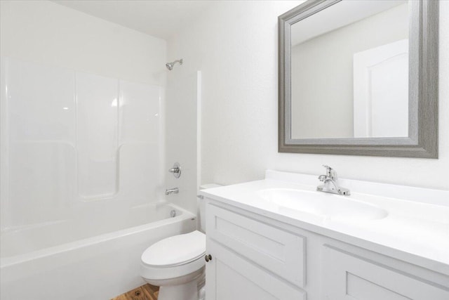 full bathroom with shower / bath combination, vanity, and toilet