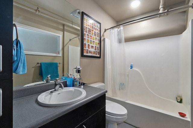 full bathroom with vanity, toilet, and shower / bath combo with shower curtain