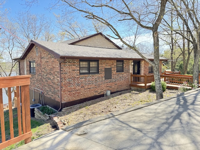 view of home's exterior featuring a wooden deck