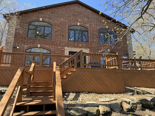 back of house featuring a deck