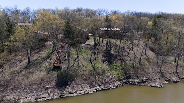 birds eye view of property featuring a water view