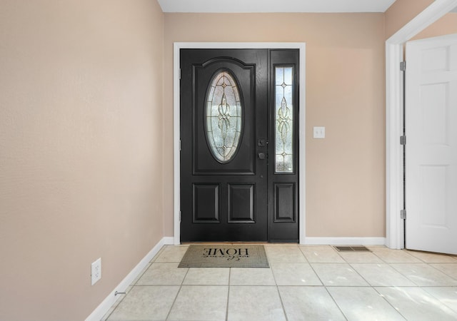 entryway featuring light tile patterned floors