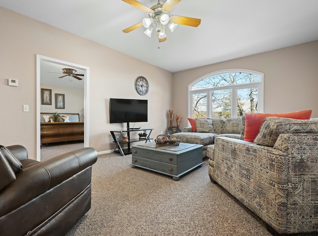 living room with carpet floors and ceiling fan