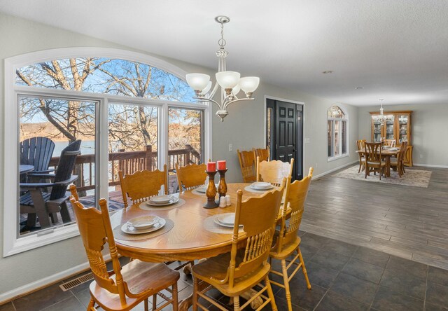 dining space featuring an inviting chandelier