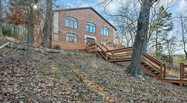 rear view of house with a wooden deck