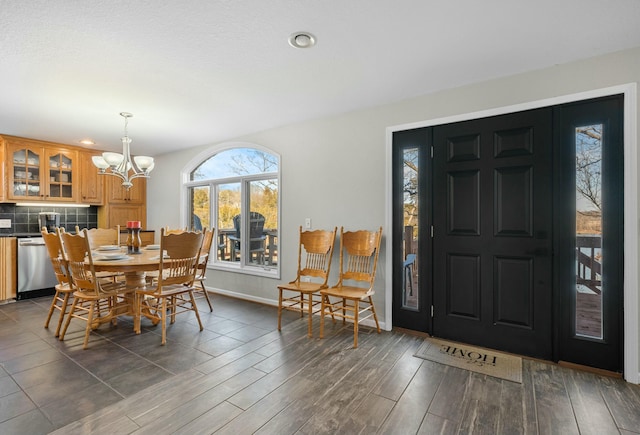 interior space with dark hardwood / wood-style flooring and a notable chandelier