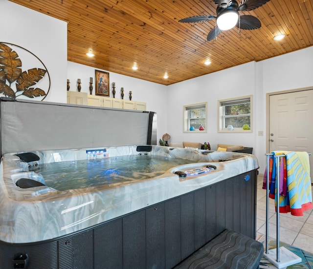 kitchen with light tile patterned floors, wood ceiling, and ceiling fan