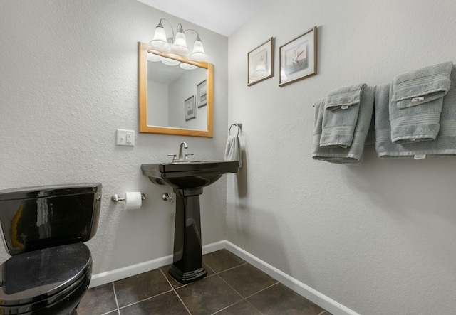 bathroom with tile patterned floors and toilet