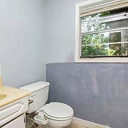 bathroom with vanity and toilet