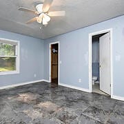 interior space featuring ceiling fan