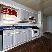 kitchen with ventilation hood, dark wood-type flooring, white range, and dishwasher