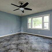 unfurnished room featuring ceiling fan