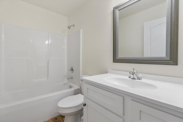 full bathroom with shower / bathing tub combination, vanity, and toilet