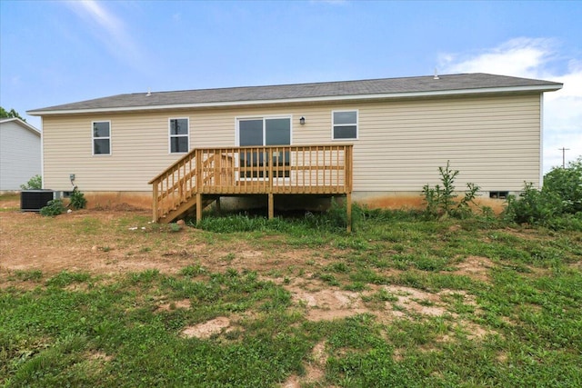 rear view of property with central AC and a deck