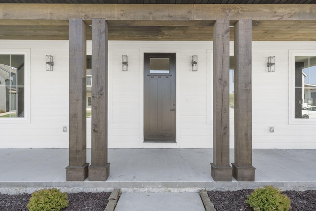 doorway to property with a porch