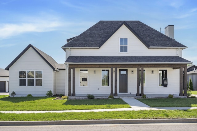 view of front of home featuring covered porch and a front yard