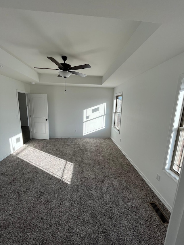 interior space with carpet flooring and multiple windows