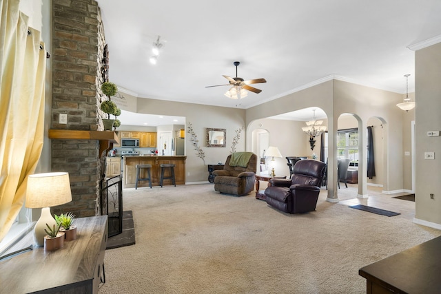 106 Willowbrooke, Branson, MO 65616 - living area with baseboards, arched walkways, ceiling fan, and light carpet