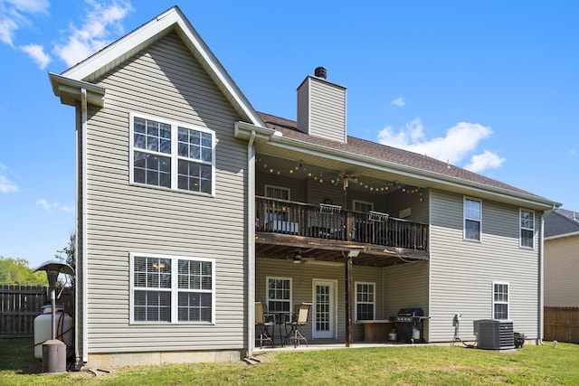 106 Willowbrooke, Branson, MO 65616 - rear view of house featuring cooling unit, a lawn, a chimney, and fence