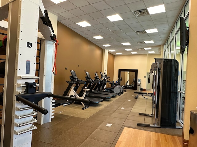 workout area featuring a drop ceiling