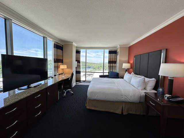 bedroom featuring floor to ceiling windows, dark colored carpet, access to exterior, crown molding, and a textured ceiling