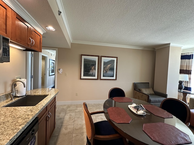 dining space with baseboards, a textured ceiling, and ornamental molding