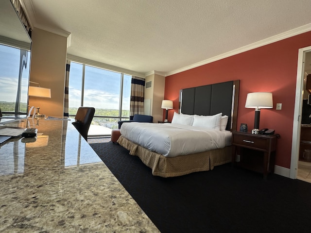 bedroom with access to exterior, ornamental molding, a baseboard heating unit, baseboards, and a textured ceiling