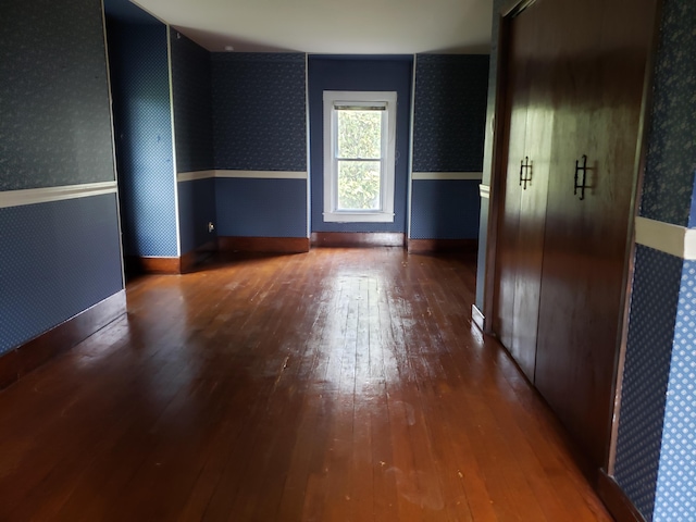 429 S Eagle Ave, Norwood, MO 65717 - unfurnished room with wallpapered walls, baseboards, and wood-type flooring