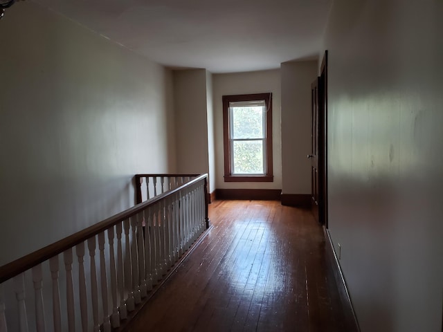 429 S Eagle Ave, Norwood, MO 65717 - corridor featuring baseboards, an upstairs landing, and wood-type flooring