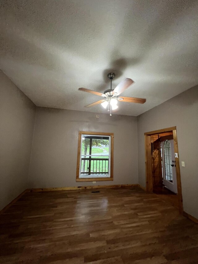 429 S Eagle Ave, Norwood, MO 65717 - spare room with baseboards, wood finished floors, a textured ceiling, and ceiling fan
