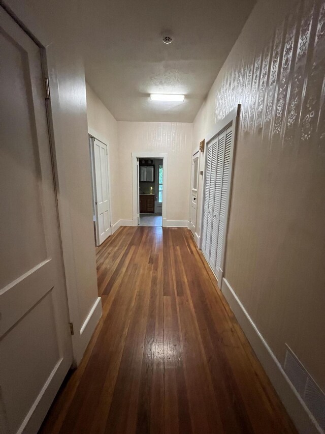 429 S Eagle Ave, Norwood, MO 65717 - hall featuring hardwood / wood-style floors, visible vents, and baseboards