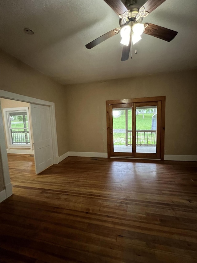 429 S Eagle Ave, Norwood, MO 65717 - spare room with wood finished floors, baseboards, ceiling fan, and a healthy amount of sunlight
