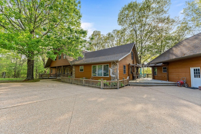 24265 Raintree Ln, Shell Knob, MO 65747 - view of front of property with a wooden deck and a shingled roof